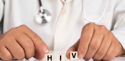 Doctor and cubes with text HIV; symptoms of HIV