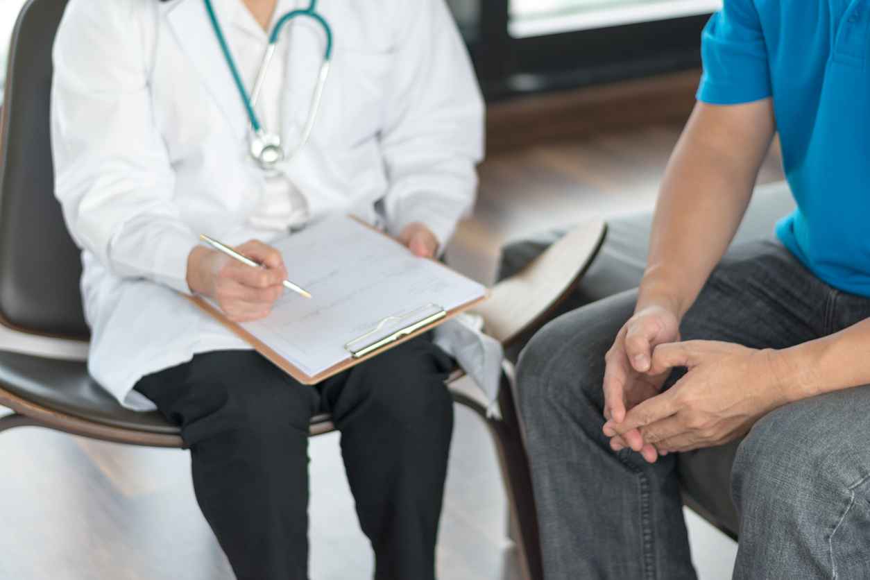 Urologist Doctor giving consult for prostate problems to patient. Urologic oncologists specialize in treating cancer of the urinary tract and male reproductive organs. Mens health problem concept.